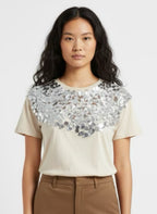 Beige top with large silver sequin on the front