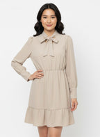 Beige skater dress with ruffle and knot at the neck