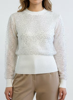 Small ribbed white sweater lined with sequin tulle