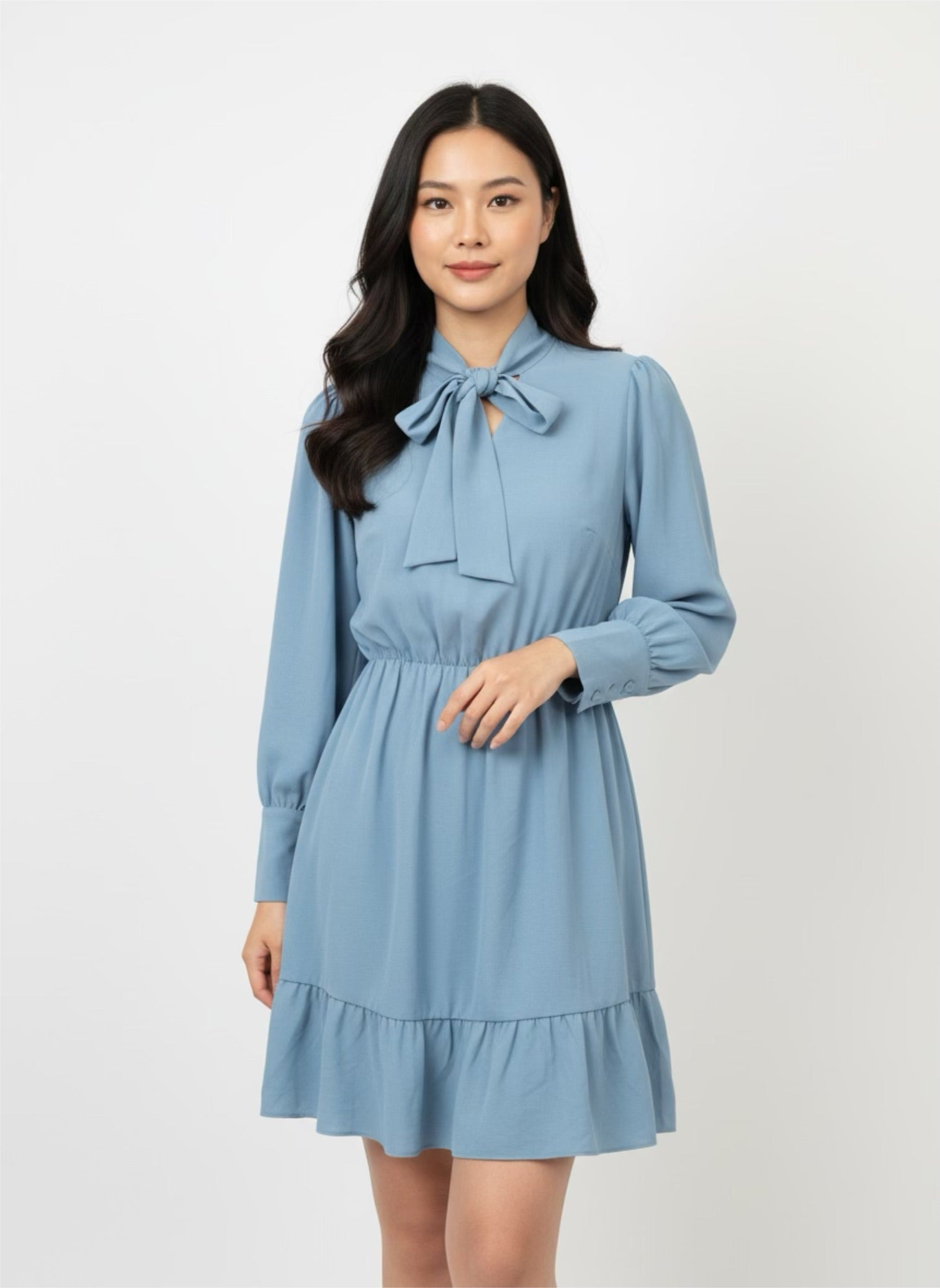 Blue skater dress with ruffle and knot at the neck