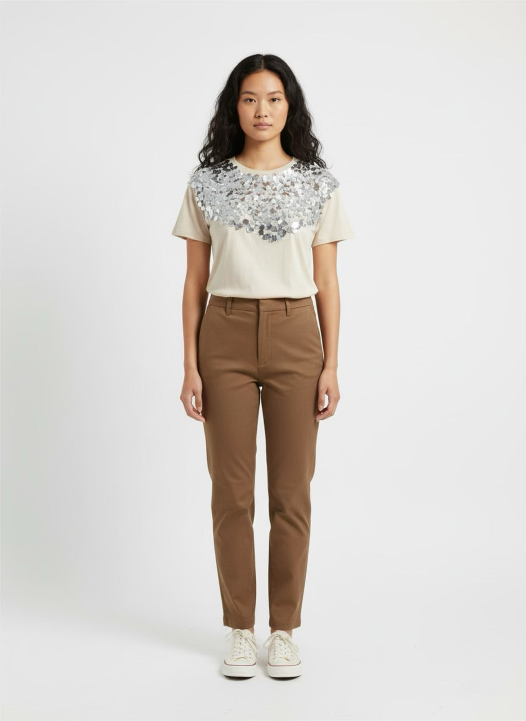 Beige top with large silver sequin on the front