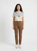 Beige top with large silver sequin on the front
