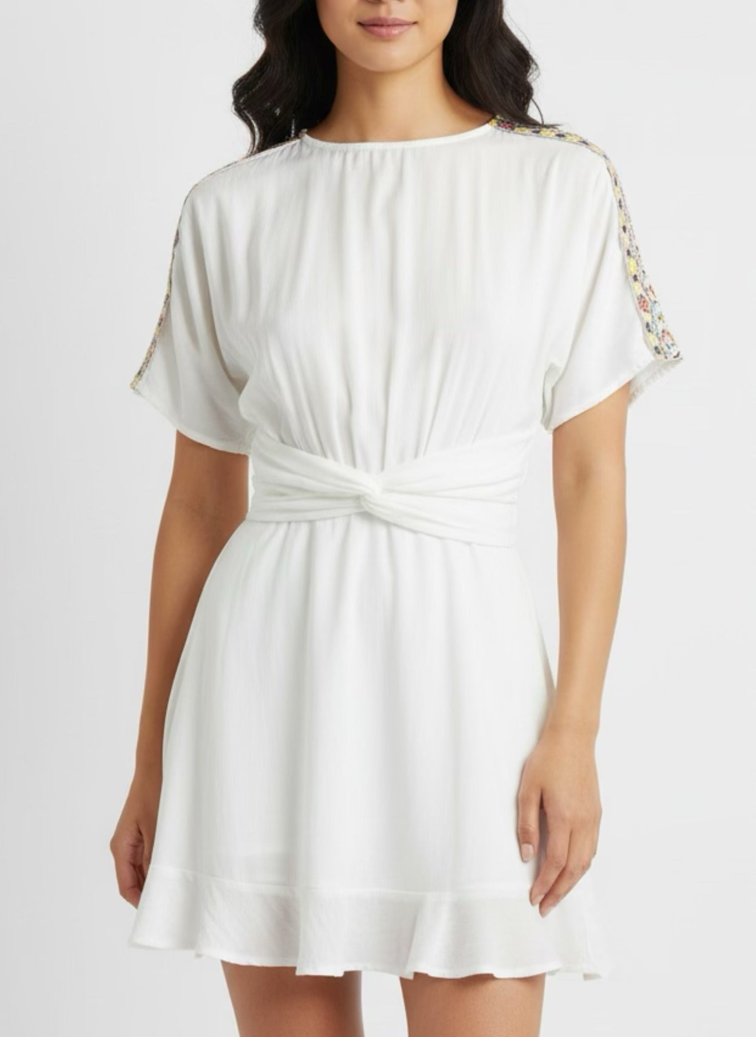 White skater dress with gold and colored yoke on the arms and open back
