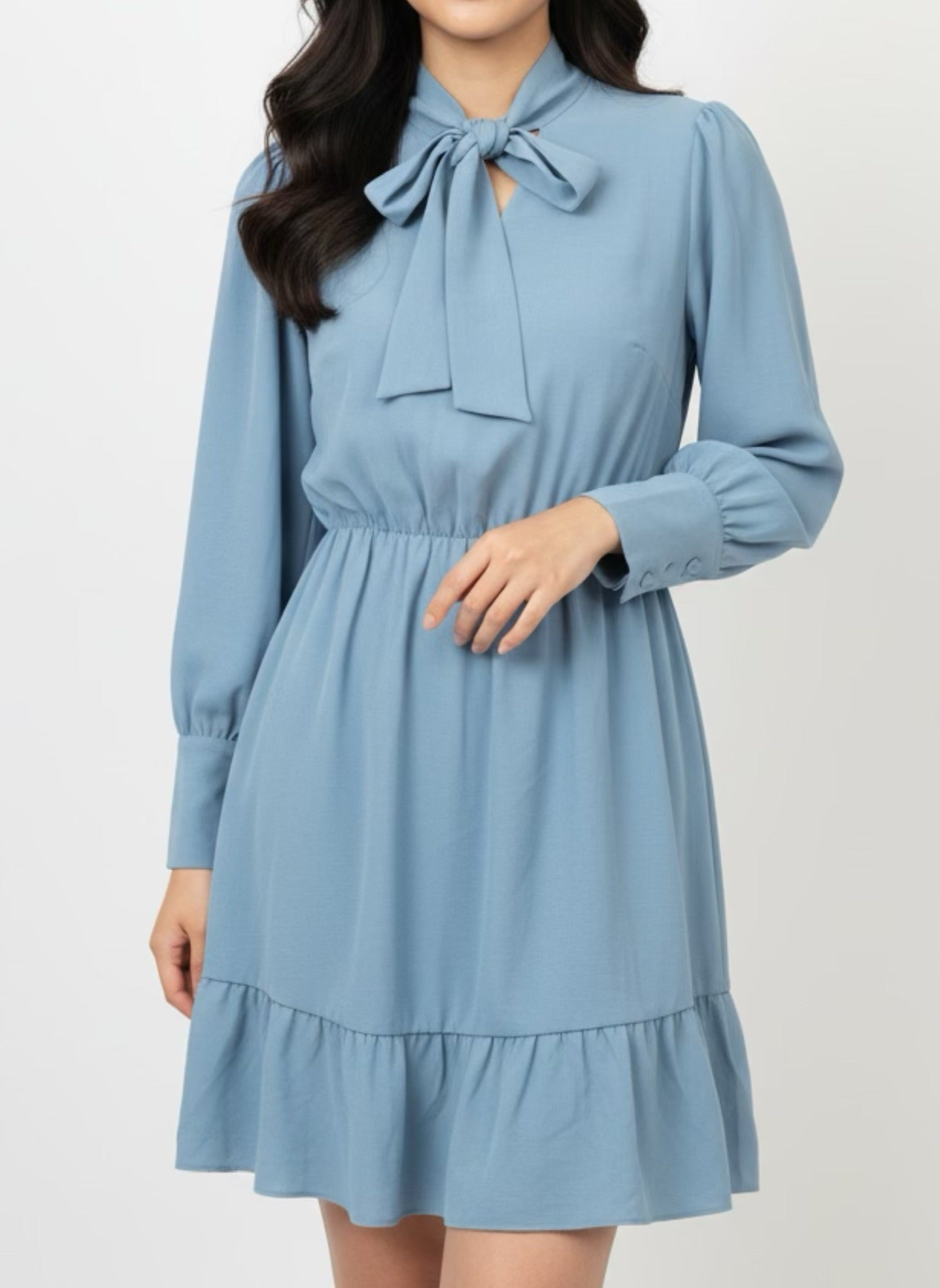 Blue skater dress with ruffle and knot at the neck