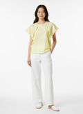 Yellow blouse with ruffle and three buttons on the shoulders