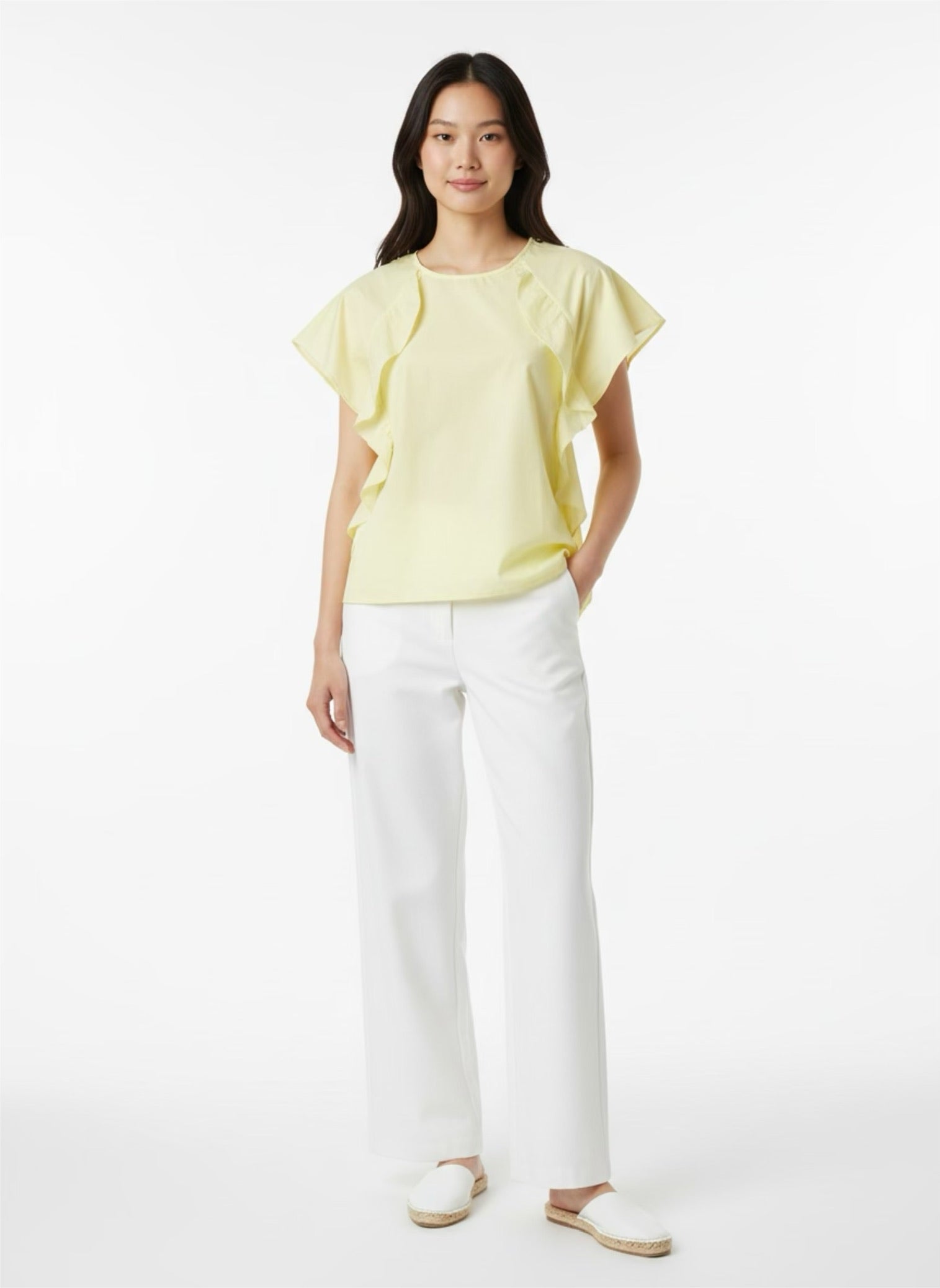 Yellow blouse with ruffle and three buttons on the shoulders