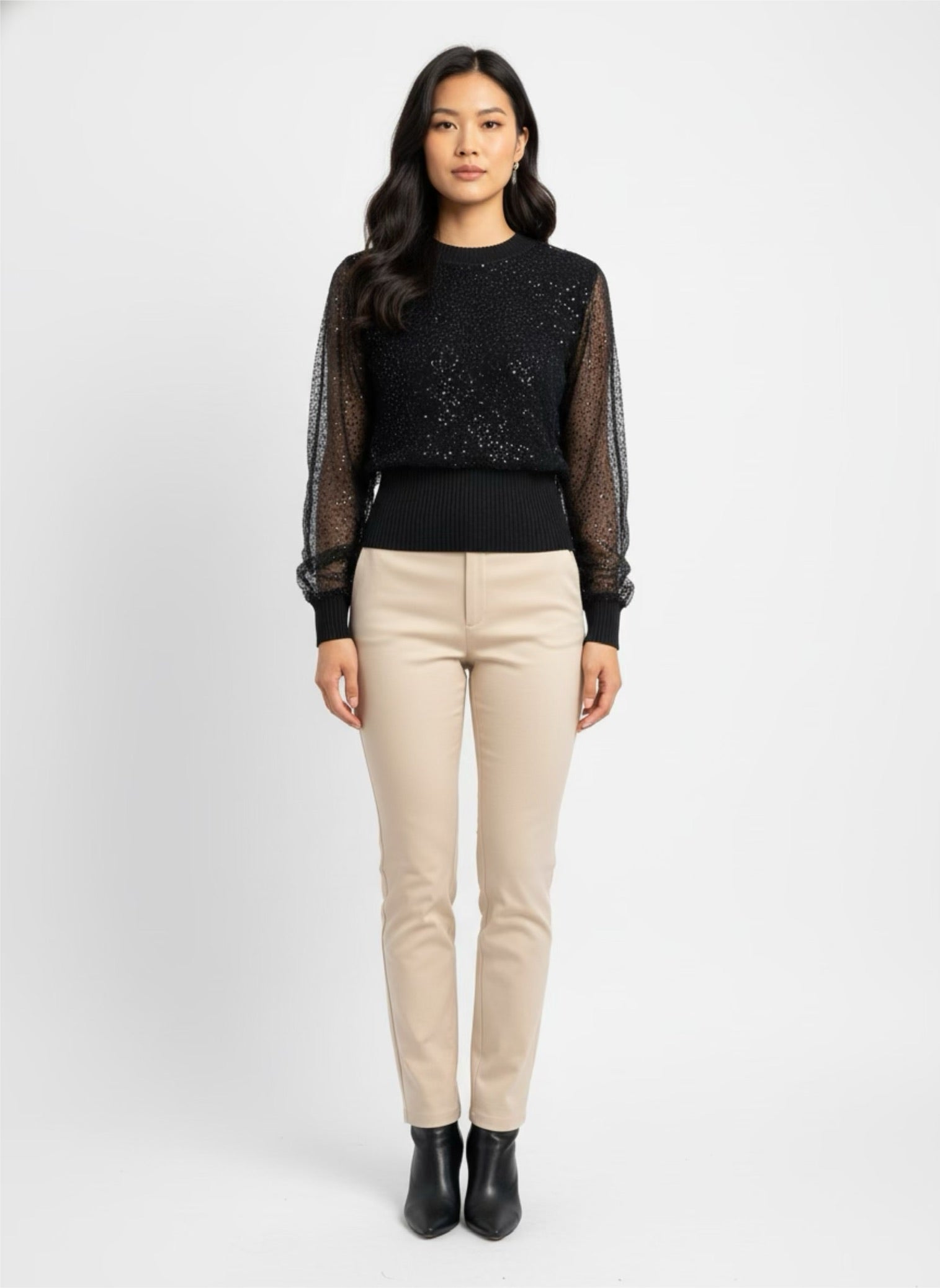 Small ribbed black sweater lined with sequin tulle