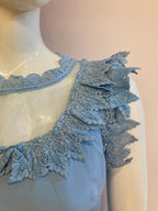 Blue dress with chiffon and lace at bust and collar.