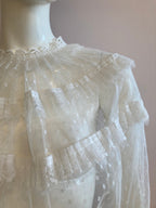 White blouse with plumetis tulle and ruffled