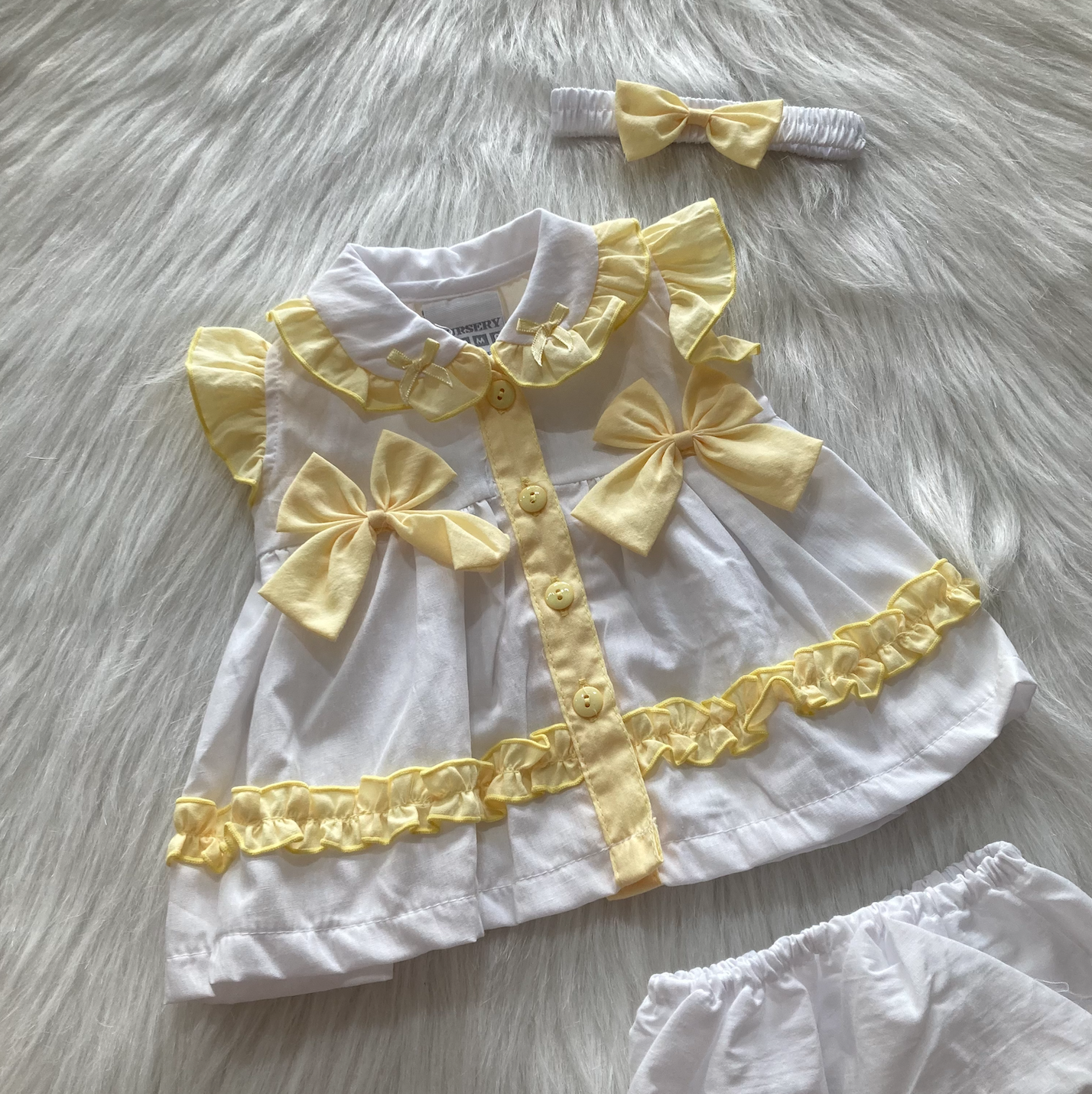 Rock a Bye Baby Meisjesjurk Wit/Geel met Strikjes
